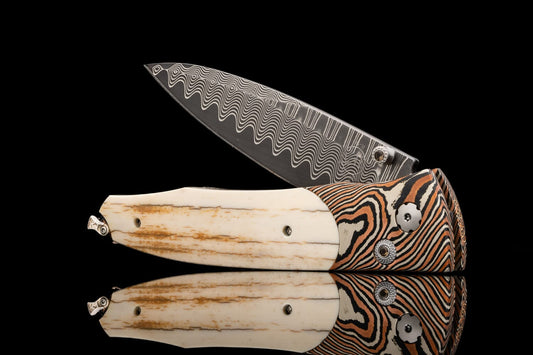 William Henry Pocketknife featuring mokume gane, fossil mammoth tusk bark, and wave damascus blade. B30 EVENTIDE