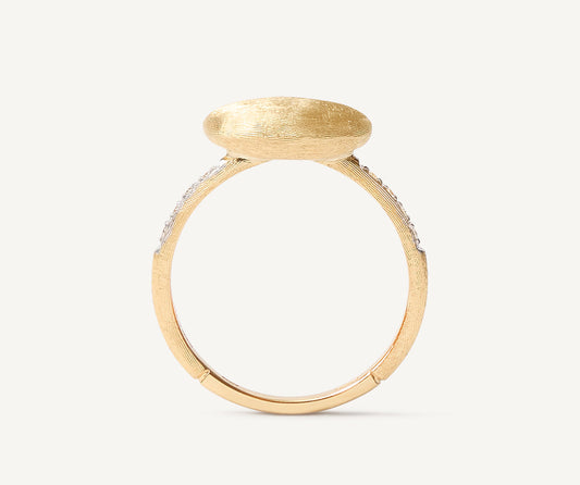 Ring with horizontal oval element and diamond shank