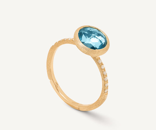 18kt yellow gold ring with sky topaz and diamonds