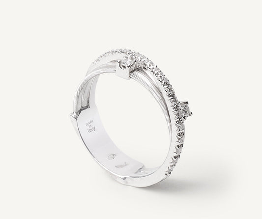 Three-band white gold ring with prong-set diamonds and a diamond-studded plaque