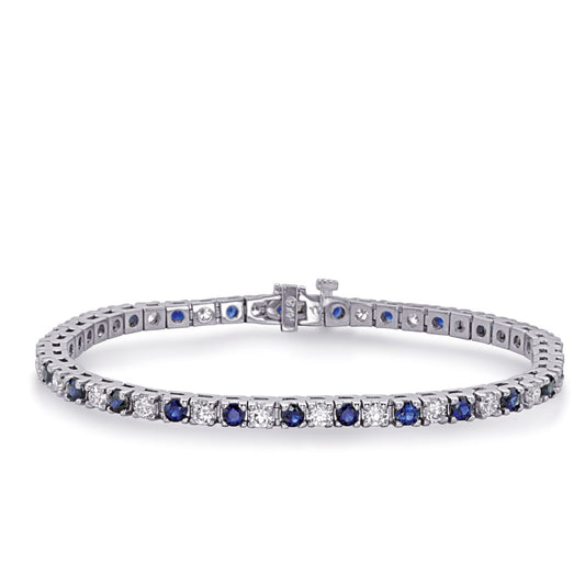This Bracelet is available in 14K White Gold. There are a total of 50 stones. There are Round with a total carat weight of 2.5 set in a  setting.There are Sapphire stones with a total carat weight of 3.9 set in a .