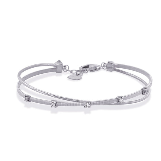 This Bracelet is available in 14K White Gold. There are a total of 5 stones. There are Round with a total carat weight of 0.2 set in a  setting.