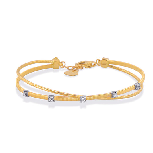 This Bracelet is available in 14K Yellow & White Gold. There are a total of 5 stones. There are Round with a total carat weight of 0.2 set in a setting.