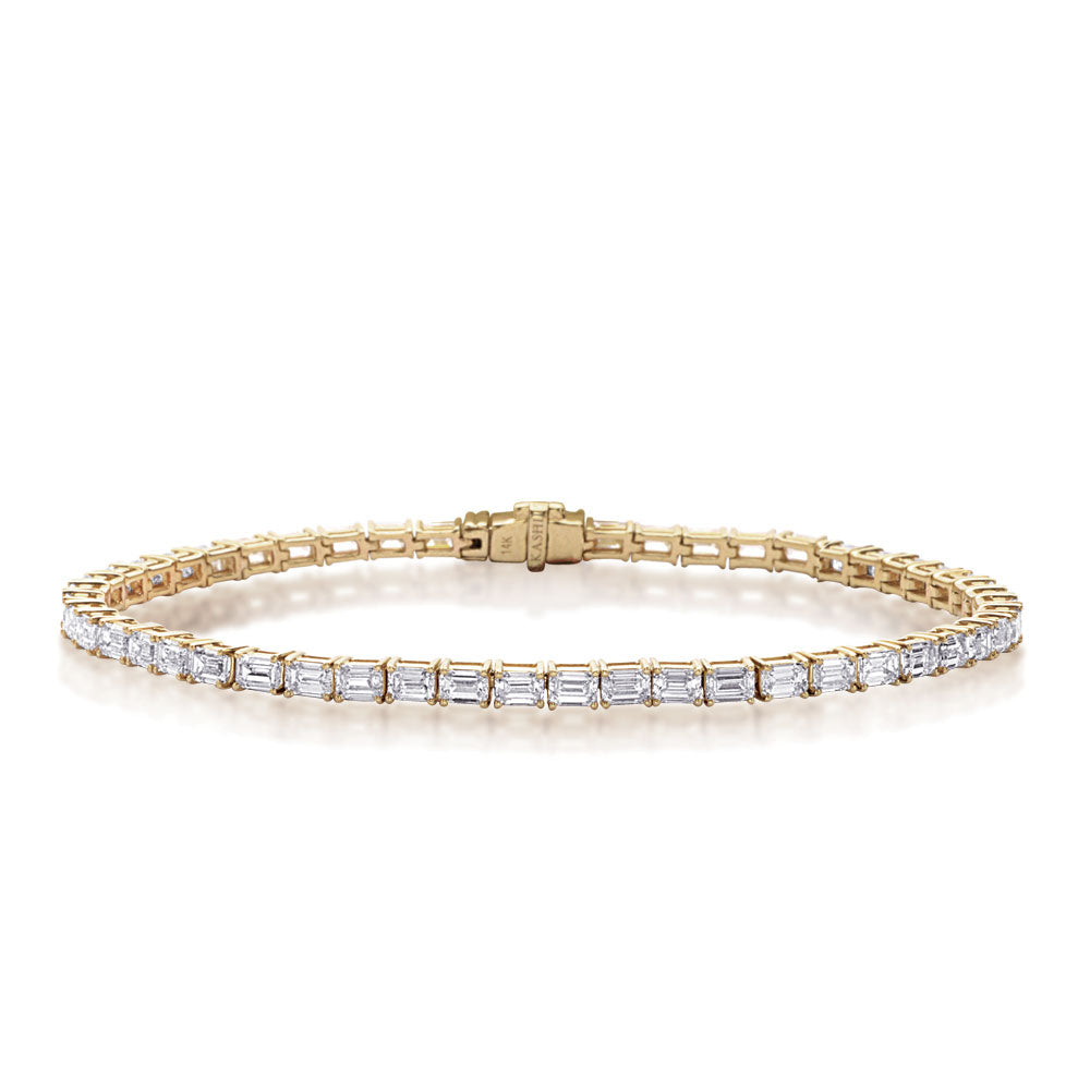 This Bracelet is available in 14K Yellow Gold. There are a total of 51 stones. There are Emerald Cut with a total carat weight of 4.65 set in a Prong Set setting.