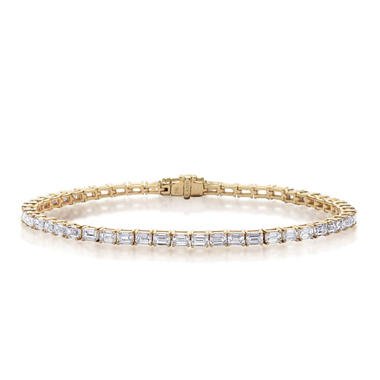 This Bracelet is available in 14K Yellow Gold. There are a total of 51 stones. There are Emerald Cut with a total carat weight of 4.65 set in a Prong Set setting.