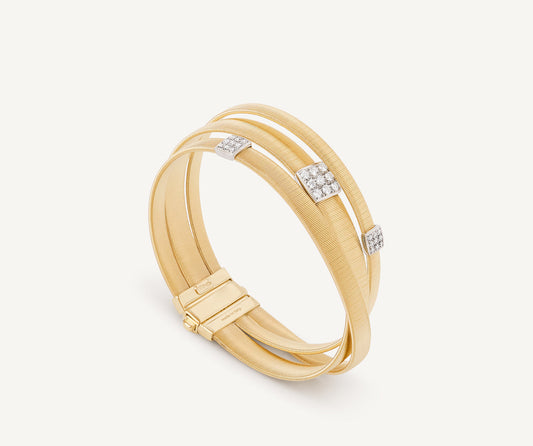 18kt yellow gold three-strand bracelet with diamond pav��