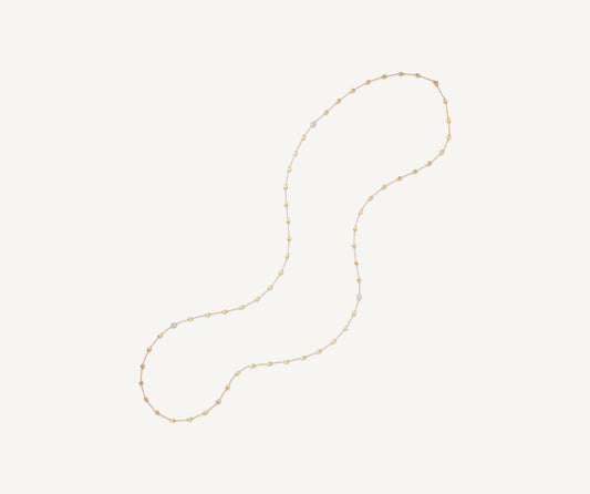 Long necklace with oval elements and diamonds