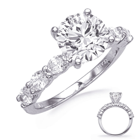 This Engagement Ring is available in 14K White Gold. There are a total of 6 stones. There are Oval with a total carat weight of 0.86 set in a setting.