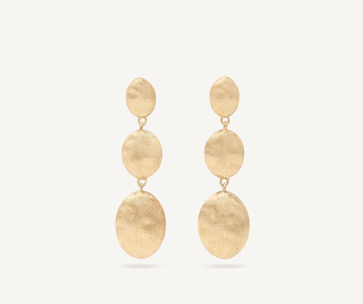 Gold triple earrings with oval elements