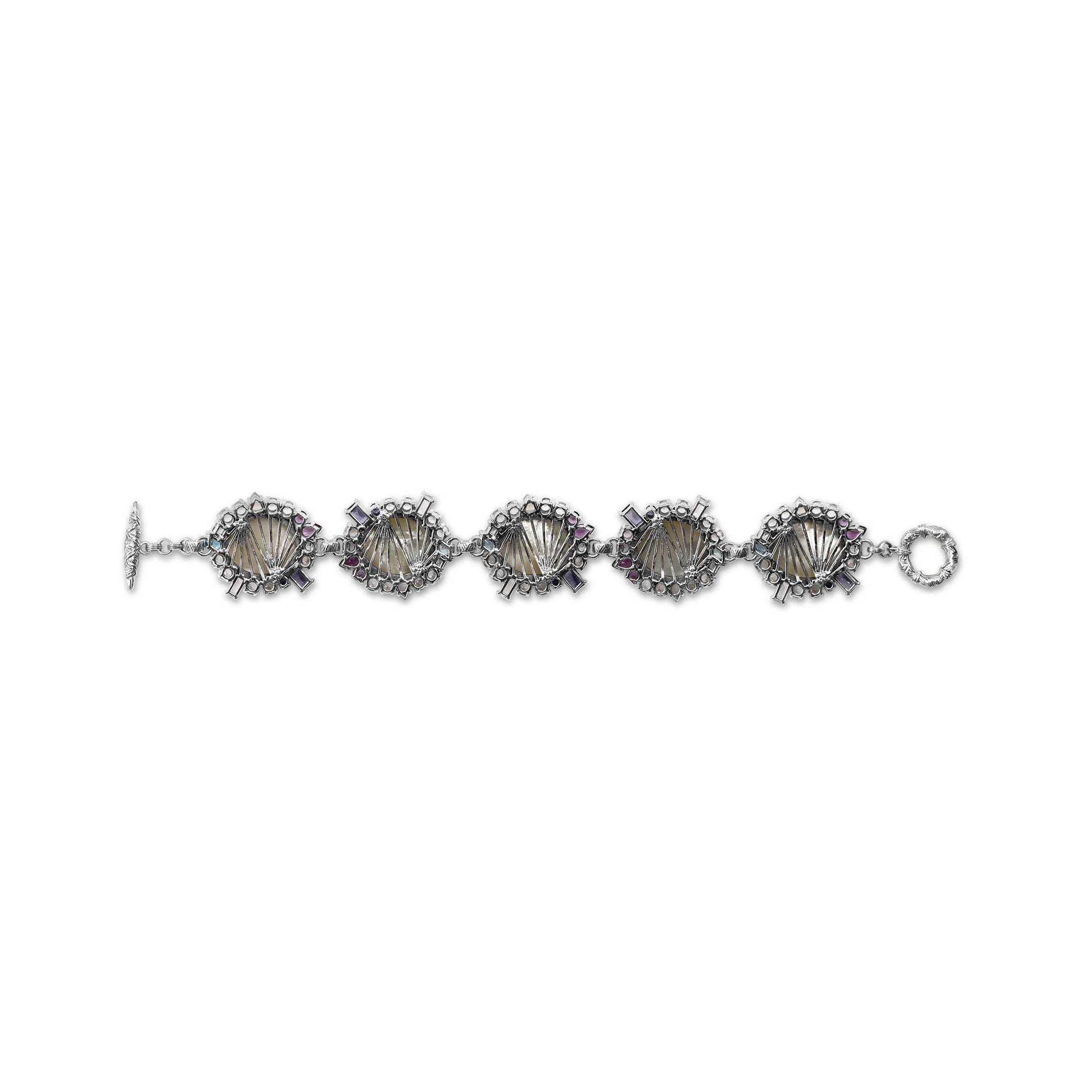 carventurous-hand-carved-mother-of-pearl-lavender-moon-quartz-amethyst-iolite-blue-and-white-topaz-bracelet-in-sterling-silver