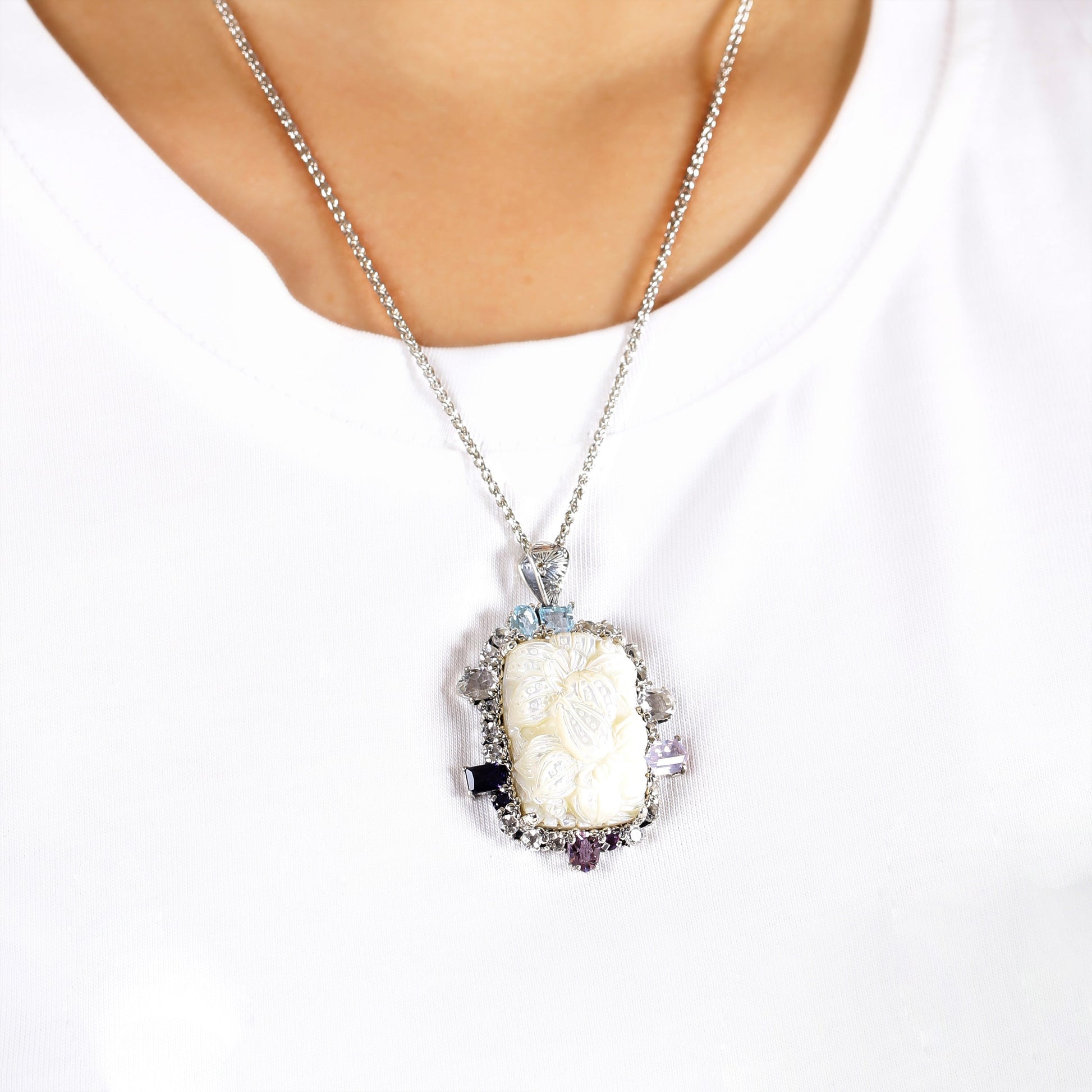 carventurous-hand-carved-mother-of-pearl-lavender-moon-quartz-amethyst-iolite-blue-and-white-topaz-pendant-in-sterling-silver