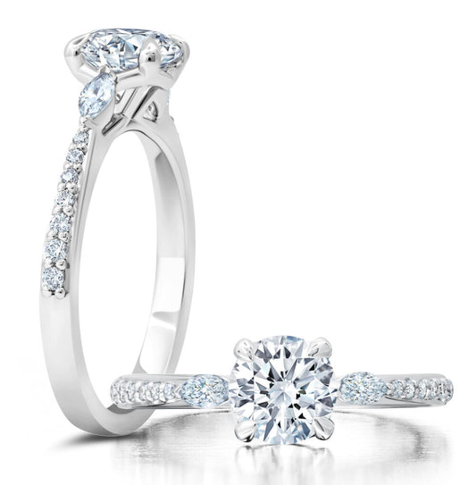 Peter Storm A classic twist on a three stone ring, this ring features two marquise diamonds sitting on either side of your chosen center WSM587_4DiaW WSM587_4DiaW