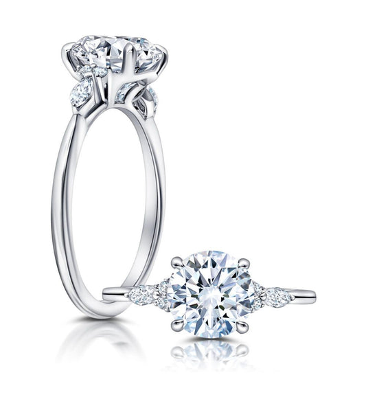 Peter Storm A classic twist on a three stone ring, this ring features two marquise and four round diamonds sitting on either side of your chosen center WSM608_4DiaW WSM608_4DiaW