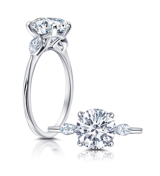 Peter Storm A classic twist on a three stone ring, this ring features two marquise diamonds sitting on either side of your chosen center WSM612_4DiaW WSM612_4DiaW
