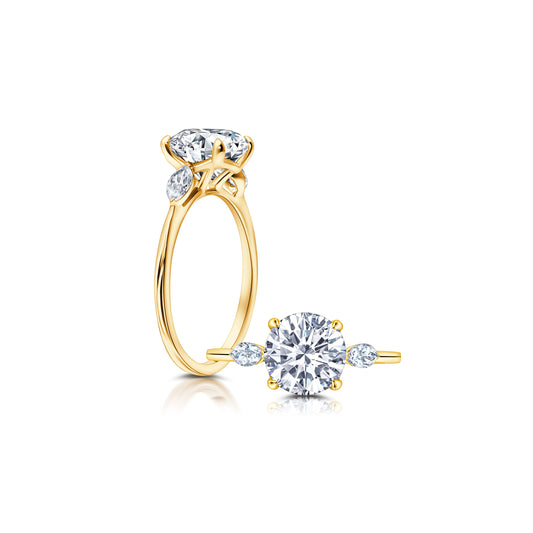 A classic twist on a three stone ring, this ring features two marquise diamonds sitting on either side of your chosen center WSM612_4DiaY