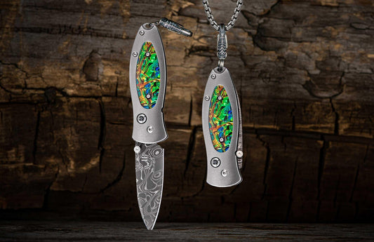 William Henry Titanium Knife pendant featuring Dichrolam®, and hand-forged damascus blade B02 FLASH