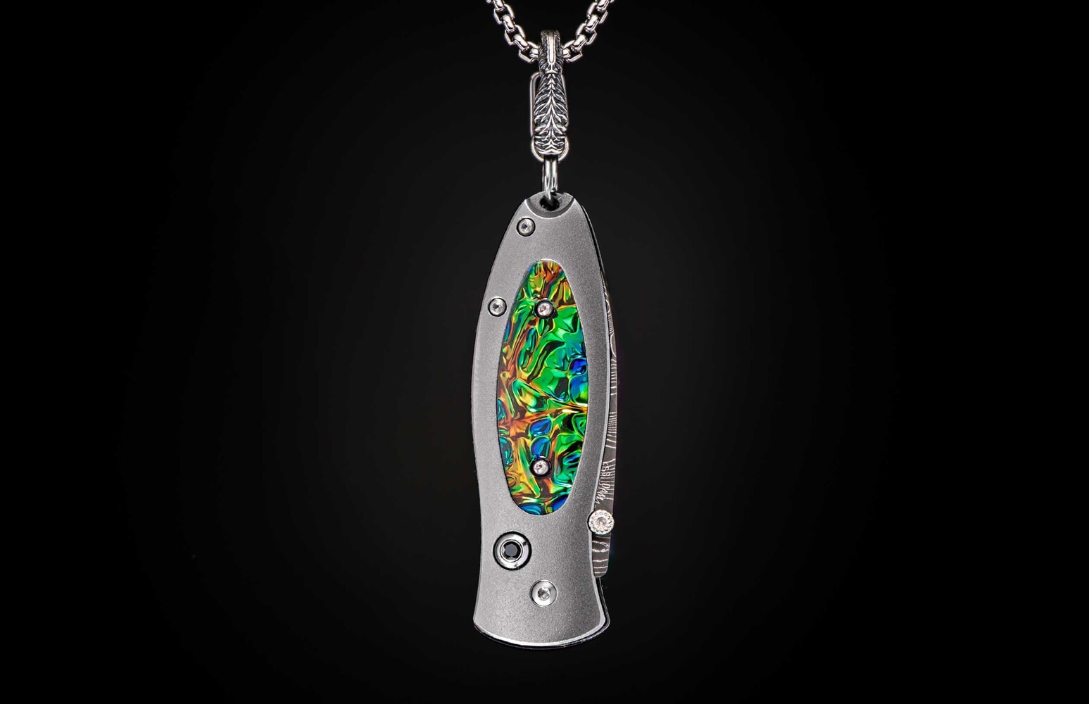 William Henry Titanium Knife pendant featuring Dichrolam®, and hand-forged damascus blade B02 FLASH