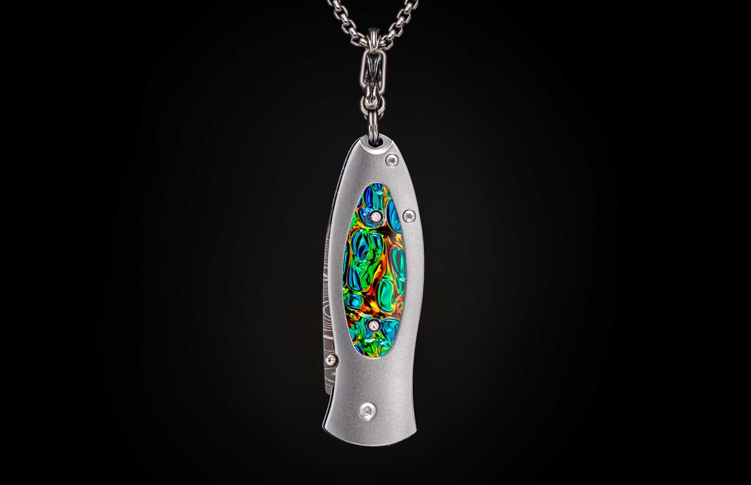 William Henry Titanium Knife pendant featuring Dichrolam®, and hand-forged damascus blade B02 FLASH