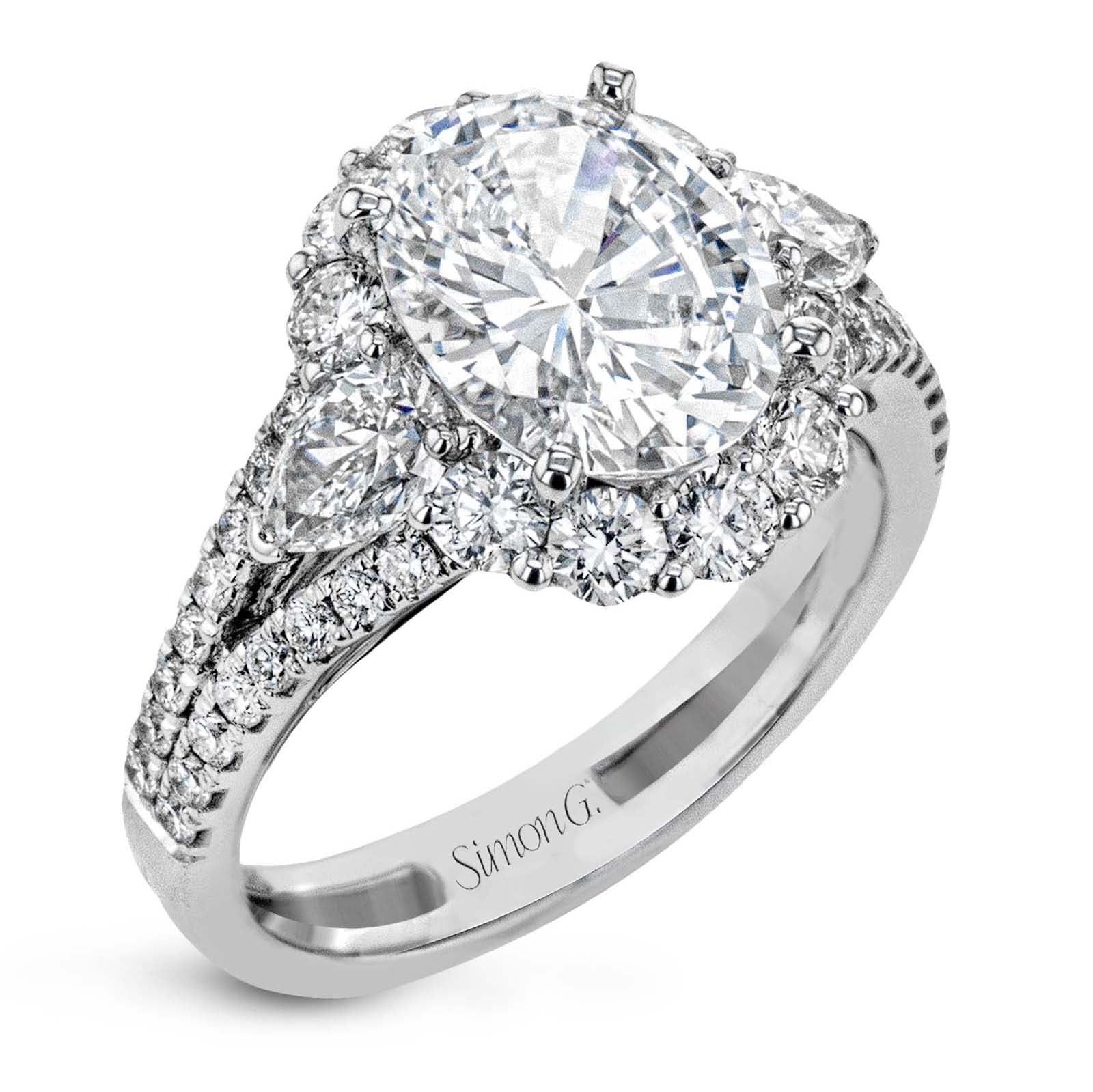 oval-cut-three-stone-halo-engagement-ring-in-18k-gold-with-diamonds