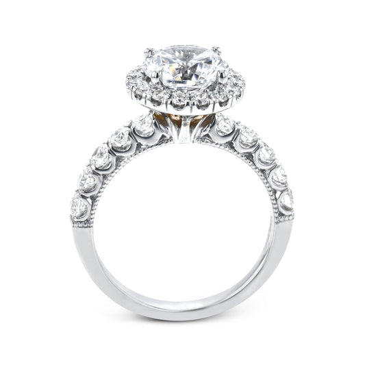 round-cut-halo-engagement-ring-in-18k-gold-with-diamonds