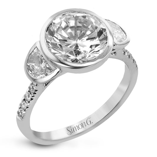 round-cut-three-stone-engagement-ring-in-18k-gold-with-diamonds