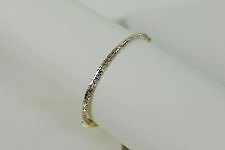 HOW MUCH IS A 14K GOLD BANGLE BRACELET WORTH?