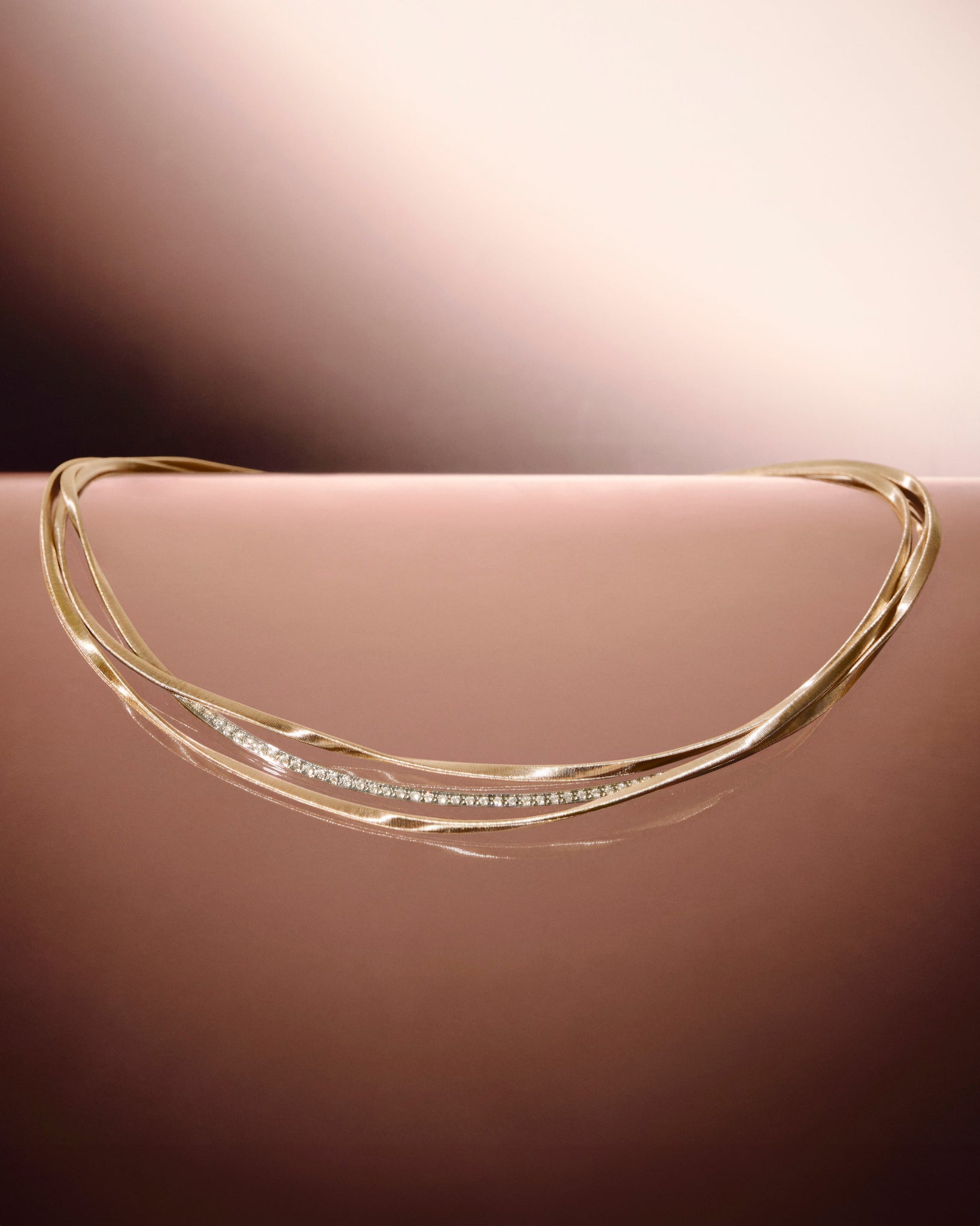 18kt yellow gold three-strand coil necklace with diamond bar