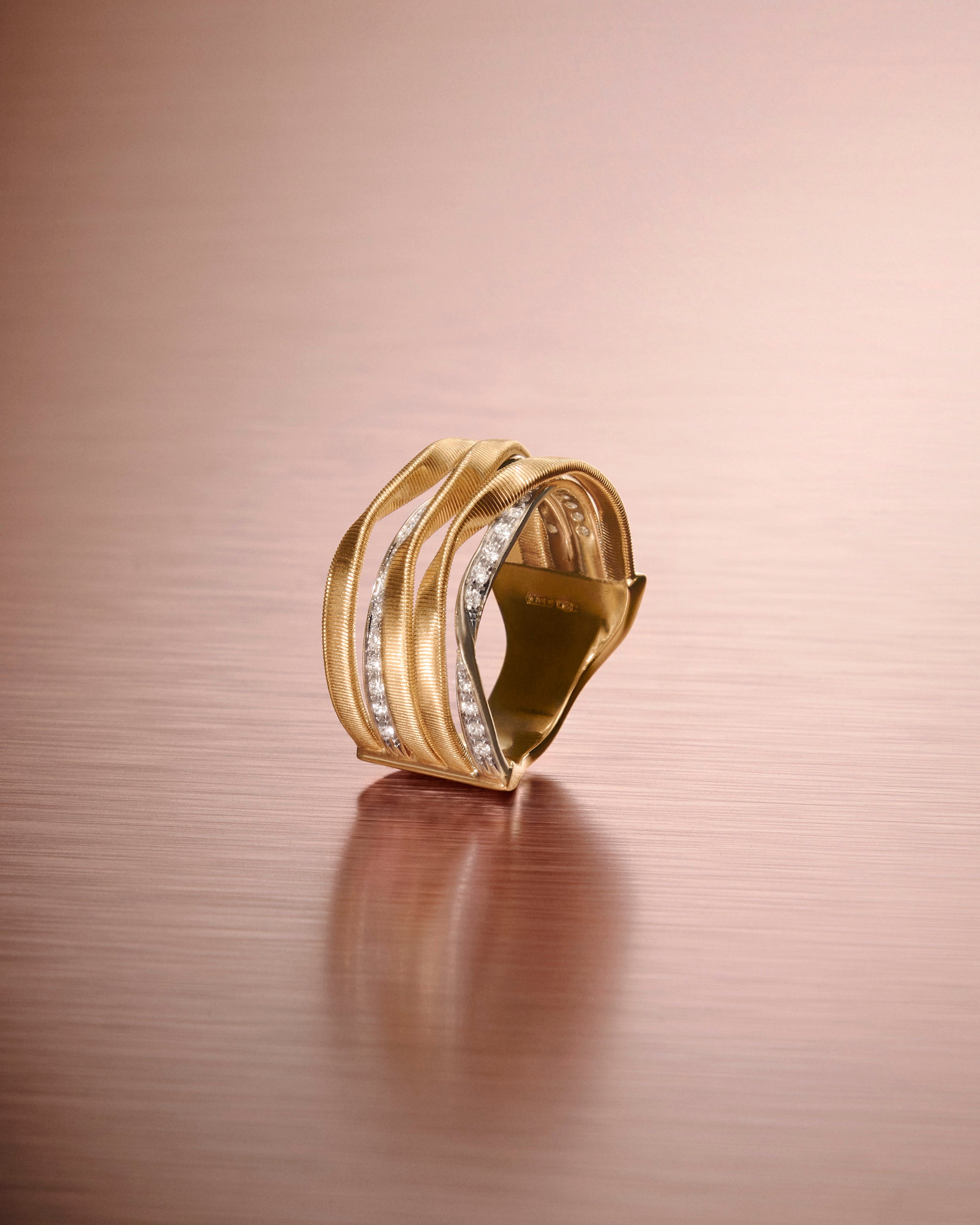 18kt yellow gold five-strand coil ring with diamonds