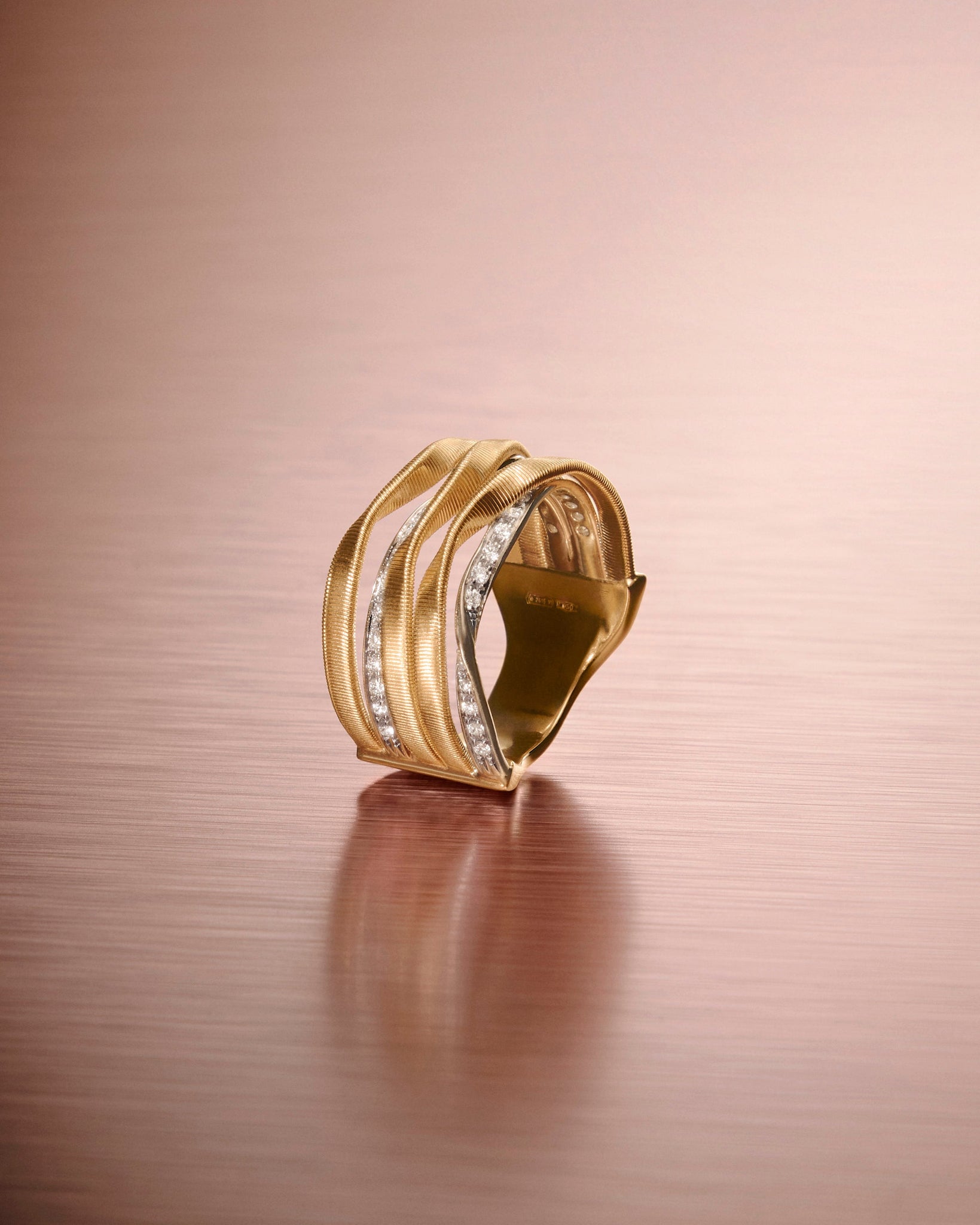 18kt yellow gold five-strand coil ring with diamonds