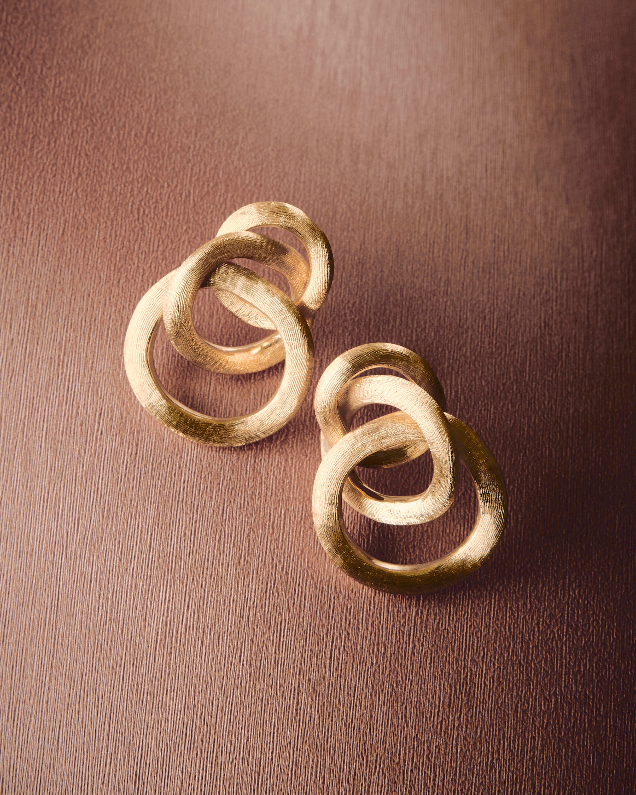 Gold stud earrings with links