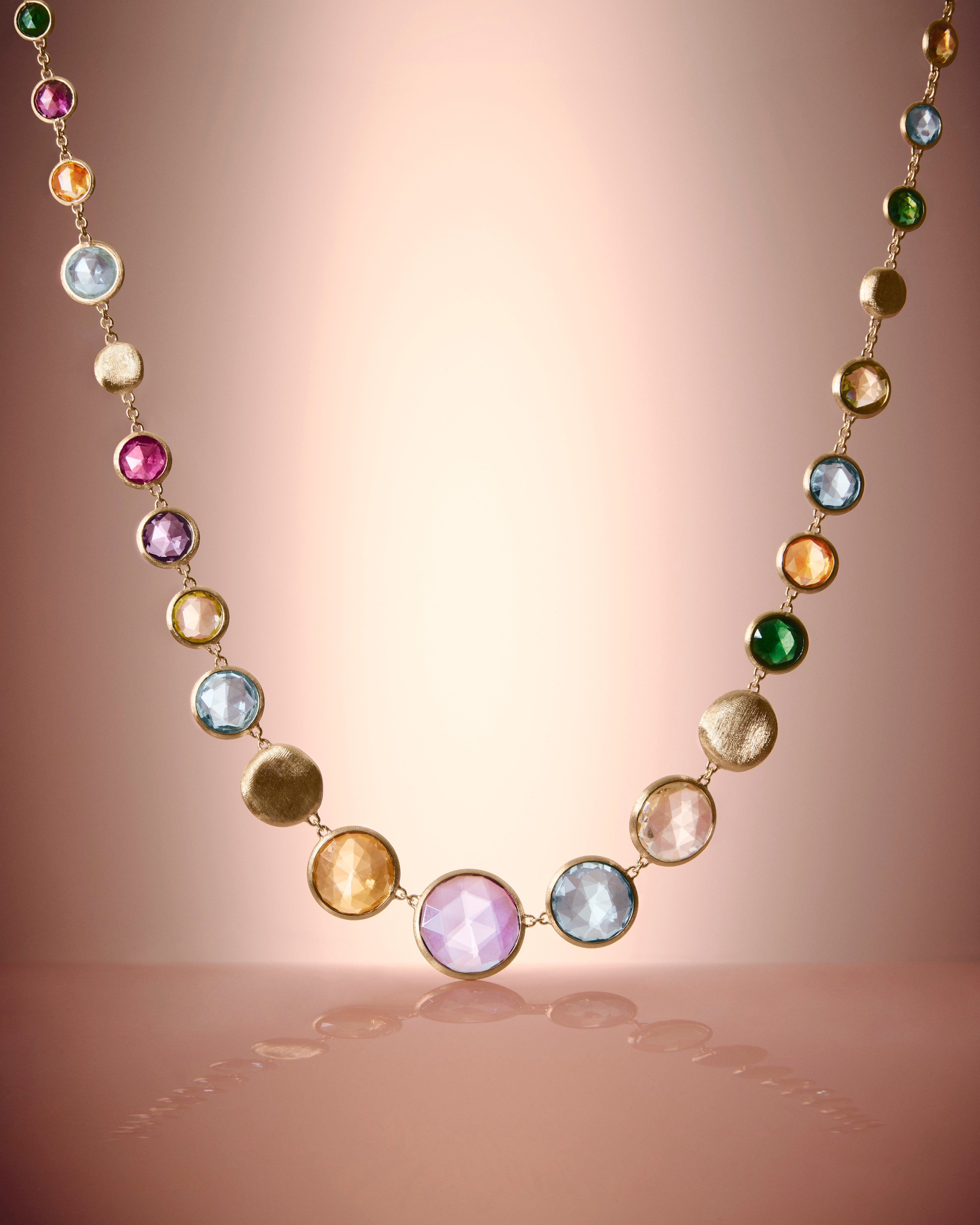 Large gold necklace with multicoloured gemstones