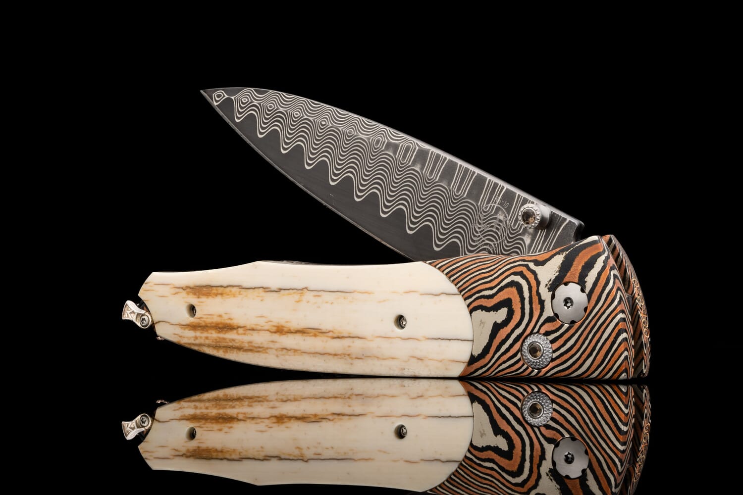 William Henry Pocketknife featuring mokume gane, fossil mammoth tusk bark, and wave damascus blade. B30 EVENTIDE