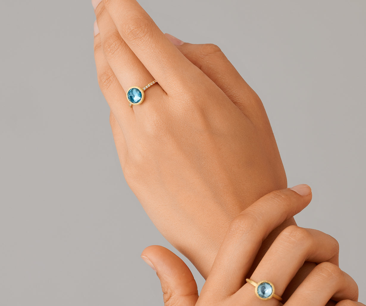 18kt-yellow-gold-ring-with-sky-topaz-and-diamonds