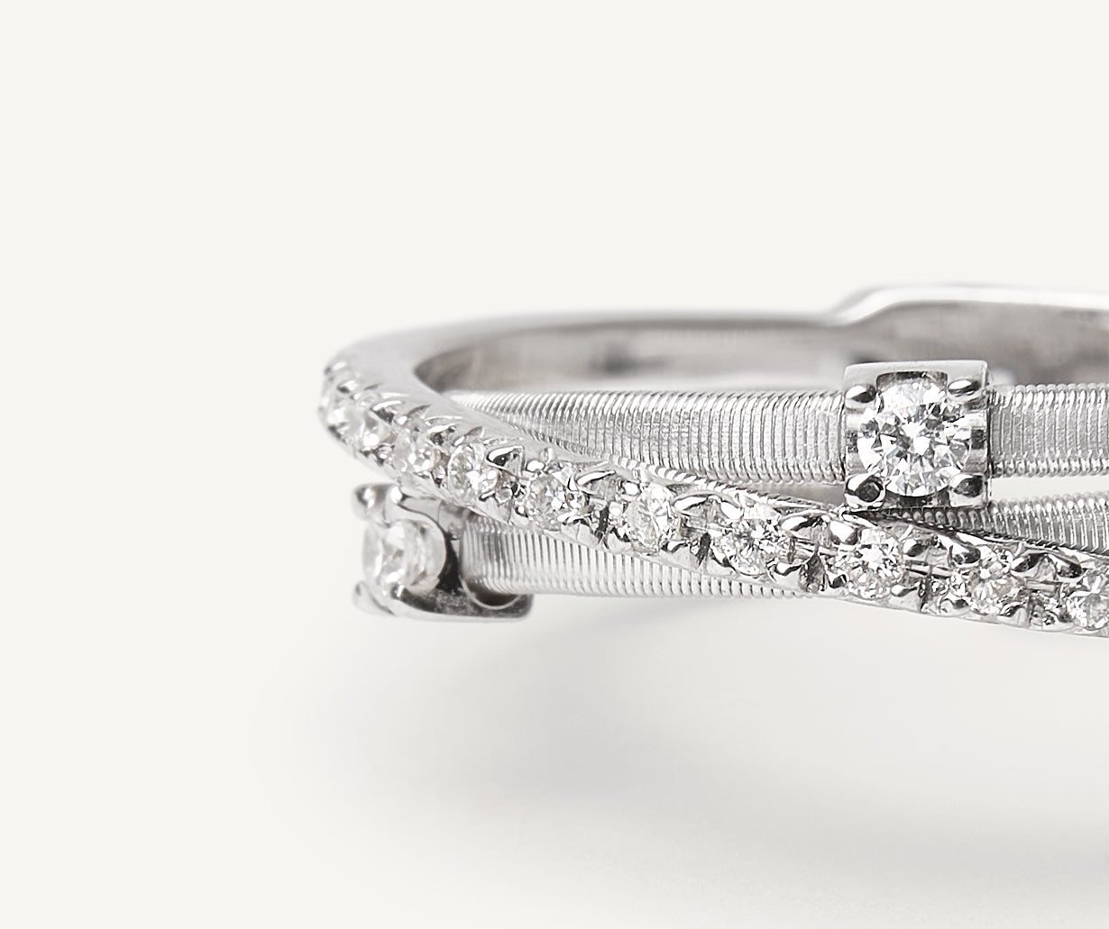 three-band-white-gold-ring-with-prong-set-diamonds-and-a-diamond-studded-plaque