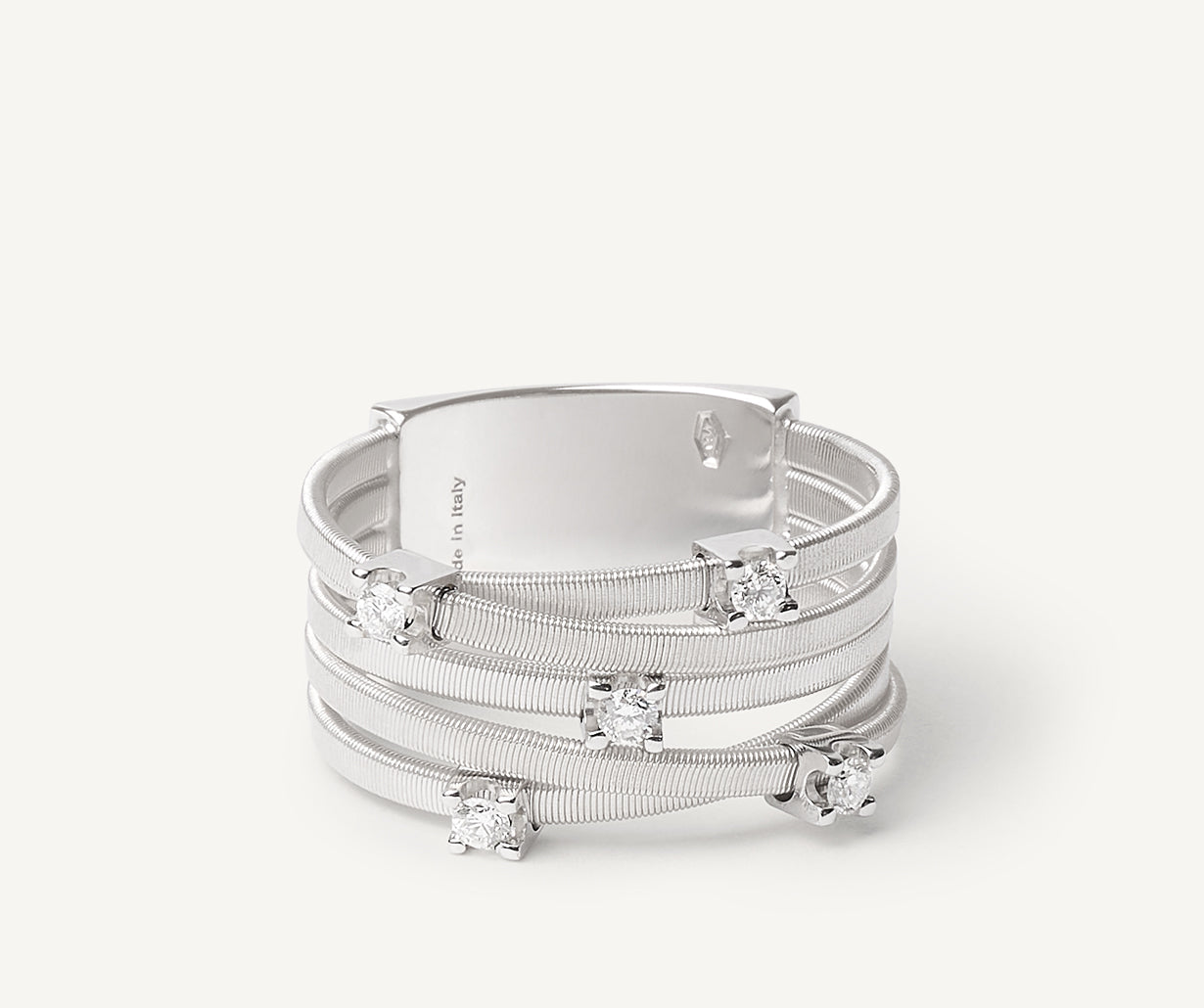 Five-band White gold ring with prong-set diamonds and a diamond-studded plaque