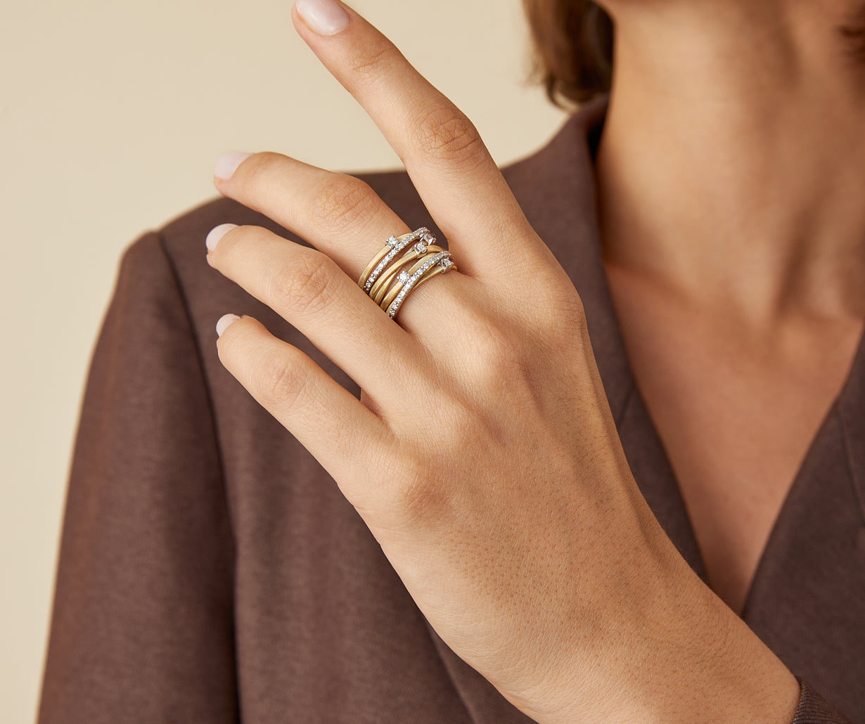 Seven-band yellow gold ring with prong-set diamonds and diamond-studded plaques