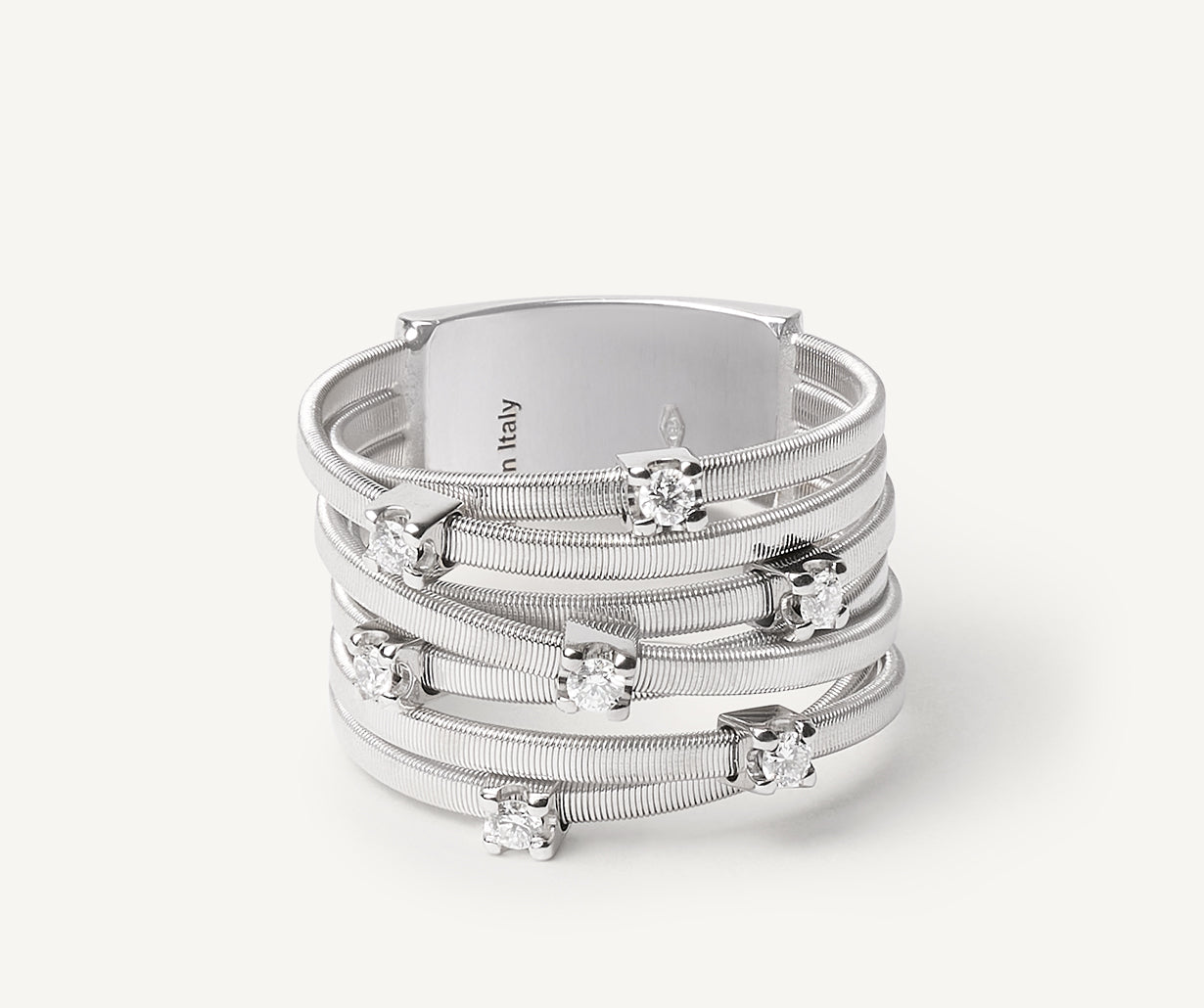 Seven-band white gold ring with prong-set diamonds
