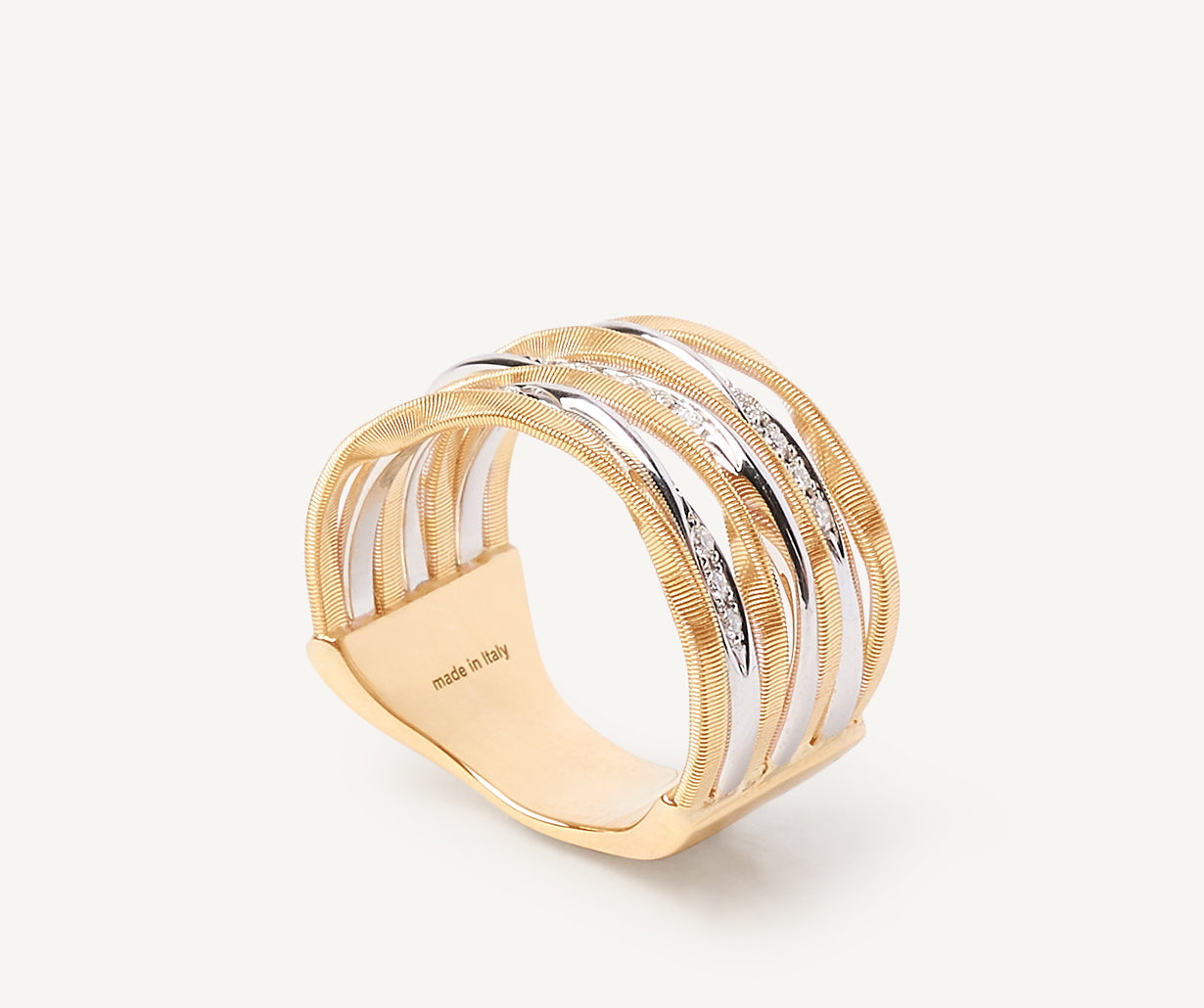 Seven-band ring with diamond-studded plaques