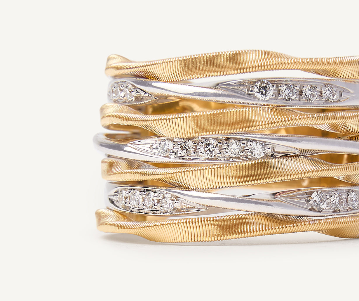 Seven-band ring with diamond-studded plaques
