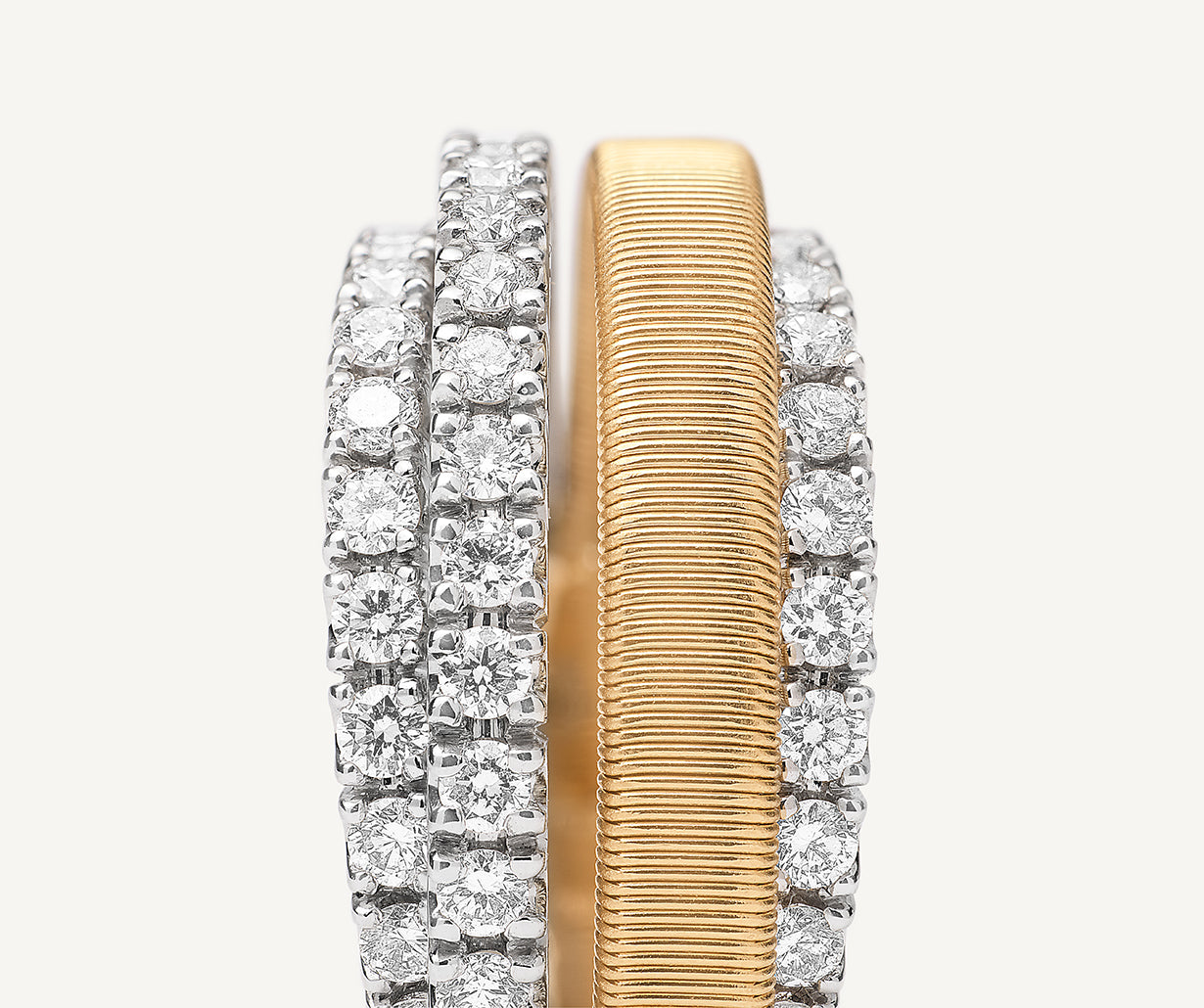 18kt yellow gold 4-strand coil ring with diamond 3 pav bands