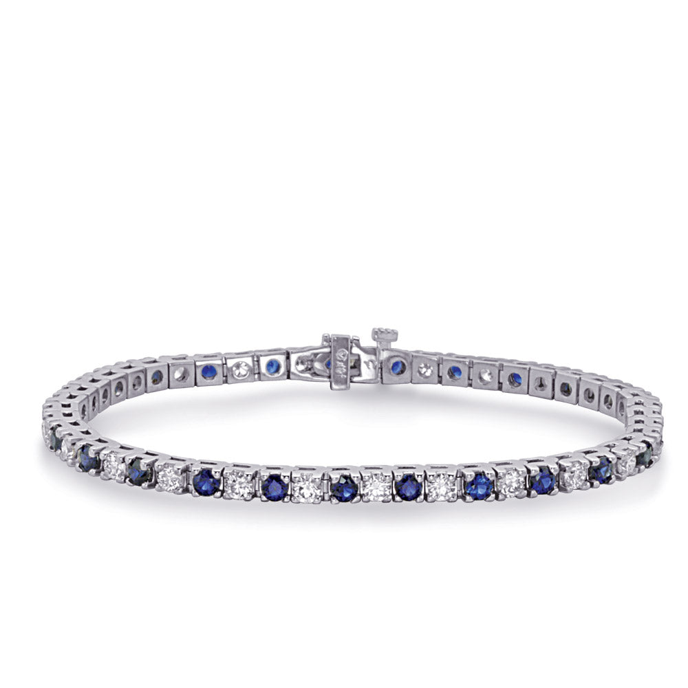This Bracelet is available in 14K White Gold. There are a total of 56 stones. There are Round with a total carat weight of 1.25 set in a  setting.There are Sapphire stones with a total carat weight of 1.88 set in a .