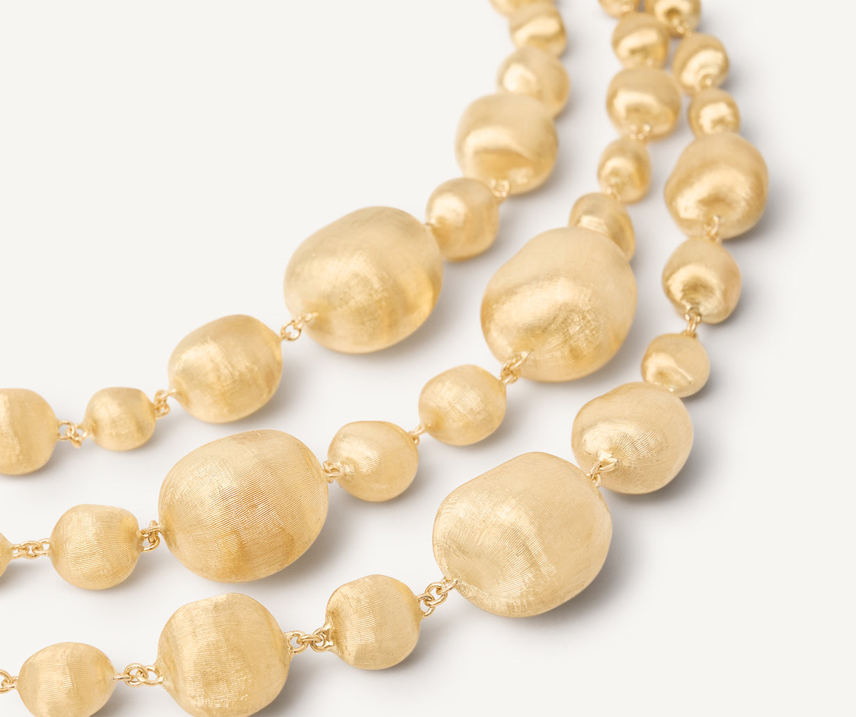 18kt yellow gold three-strand mixed bead bracelet