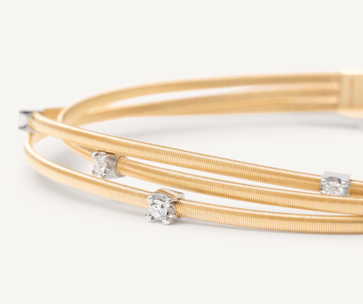Multi-strand yellow gold diamond bracelet