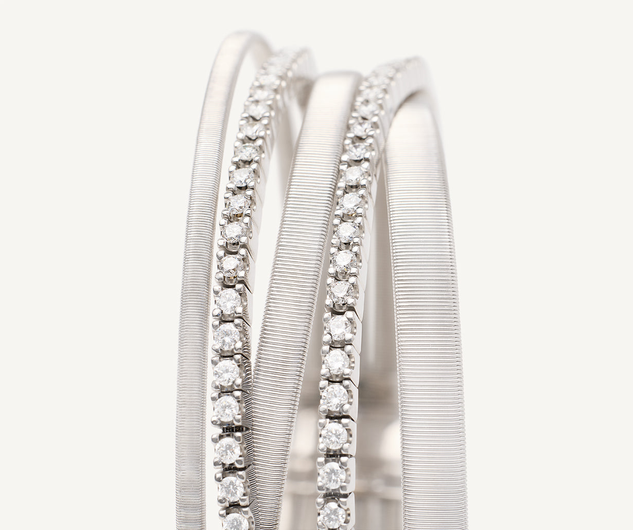 Five-strand white gold bracelet with double diamond tennis