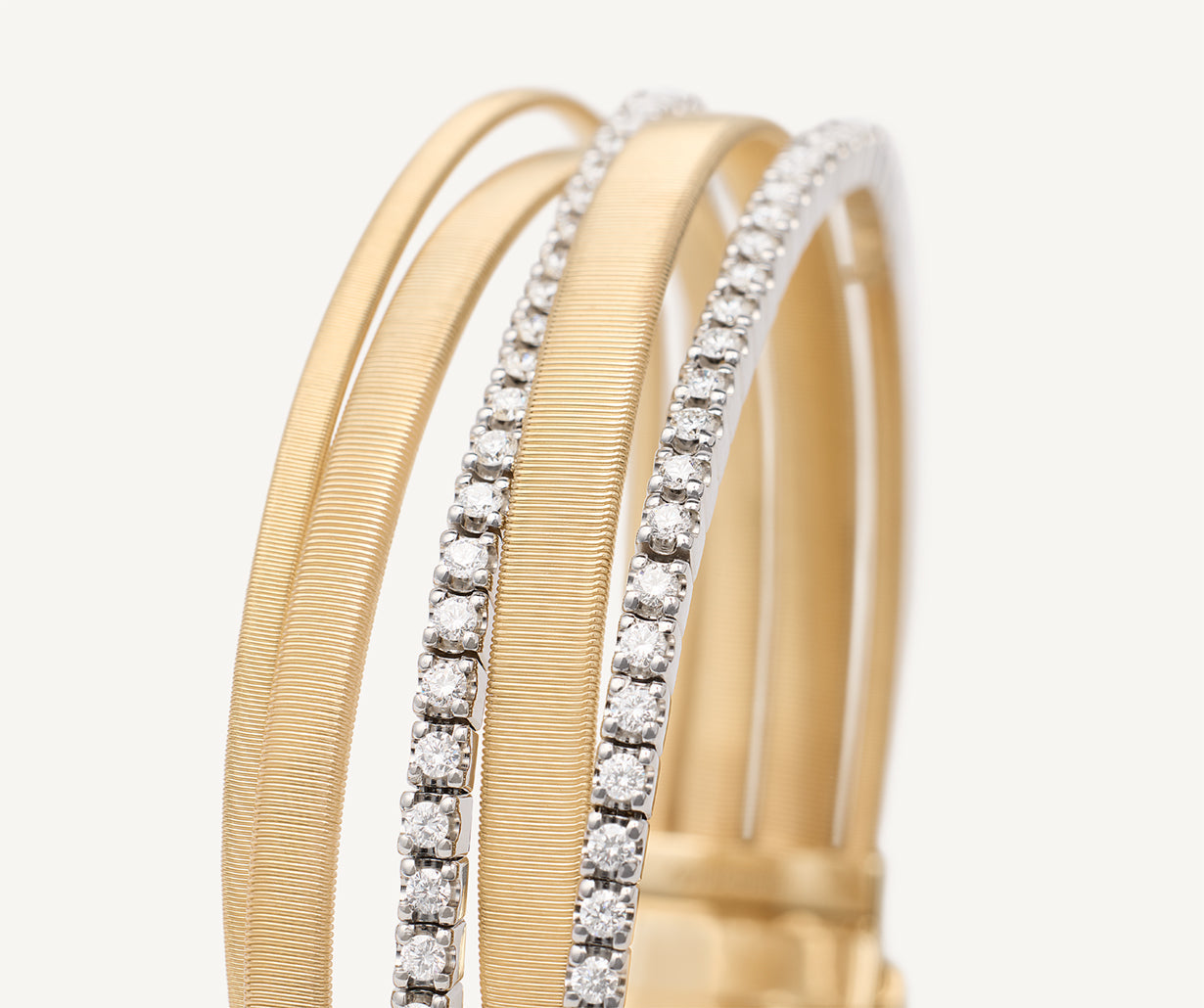 Five-strand yellow gold bracelet with double diamond tennis