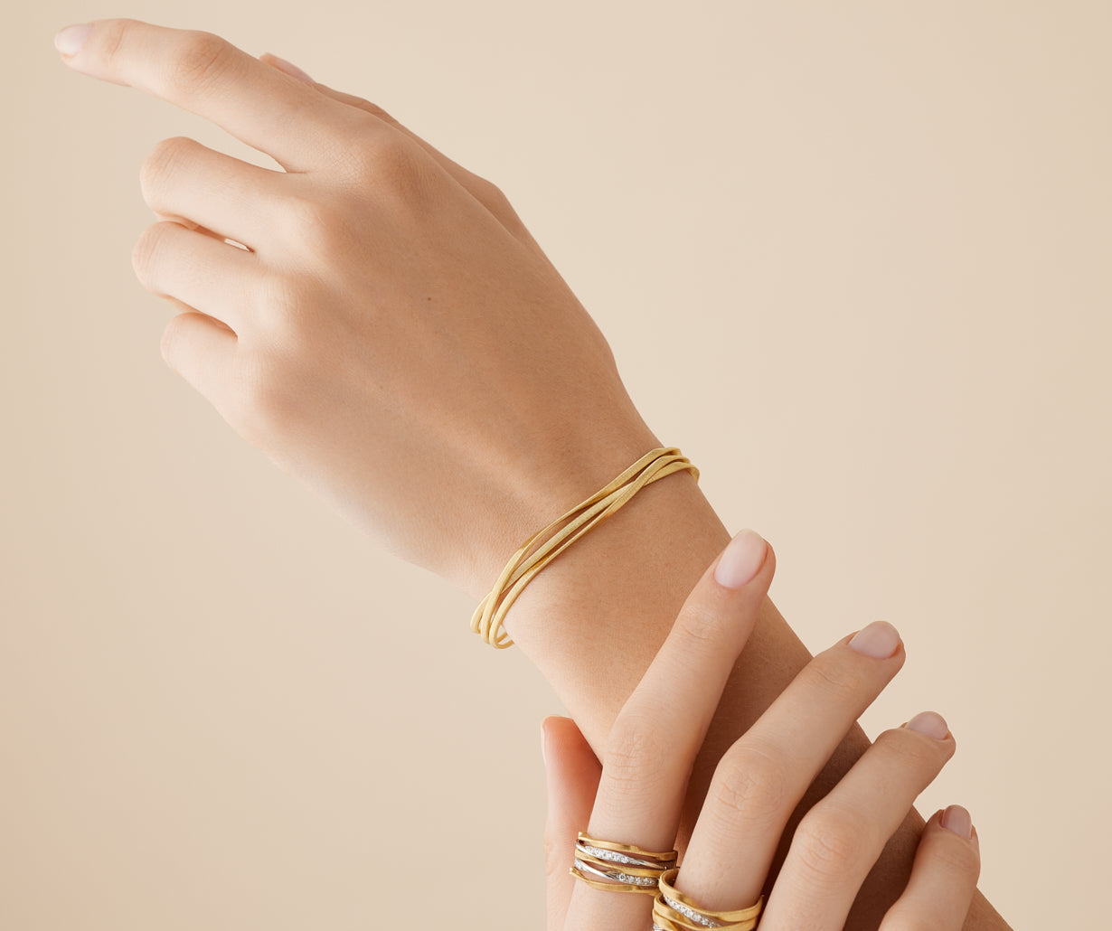 18kt yellow gold three-strand coil bracelet