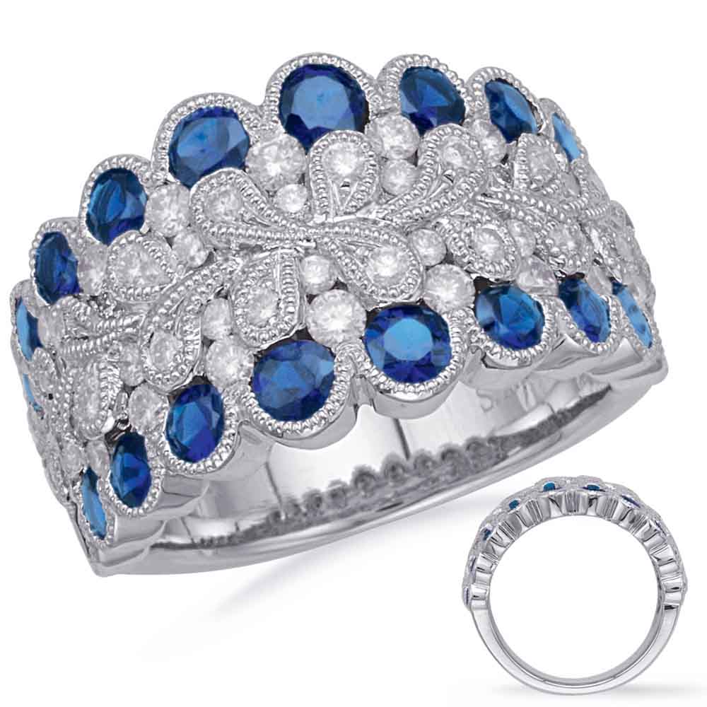 This Gem Stone Ring is available in 14K White Gold. There are a total of 72 stones. There are Rounds with a total carat weight of 0.83 set in a Bezel Set|Channel Set|Micro Prong setting.There are Sapphire stones with a total carat weight of 1.98 set in a Bezel Set|Channel Set|Micro Prong.