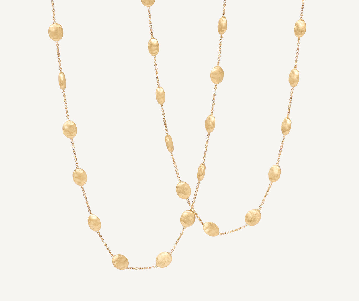 Long necklace with yellow gold oval elements