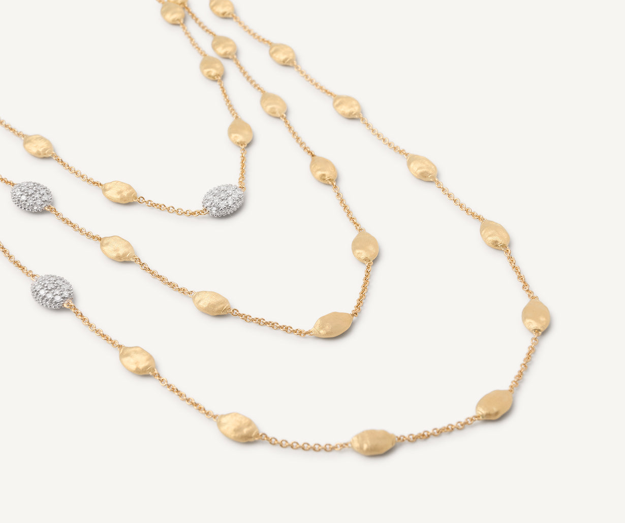 Long necklace with oval elements and diamonds