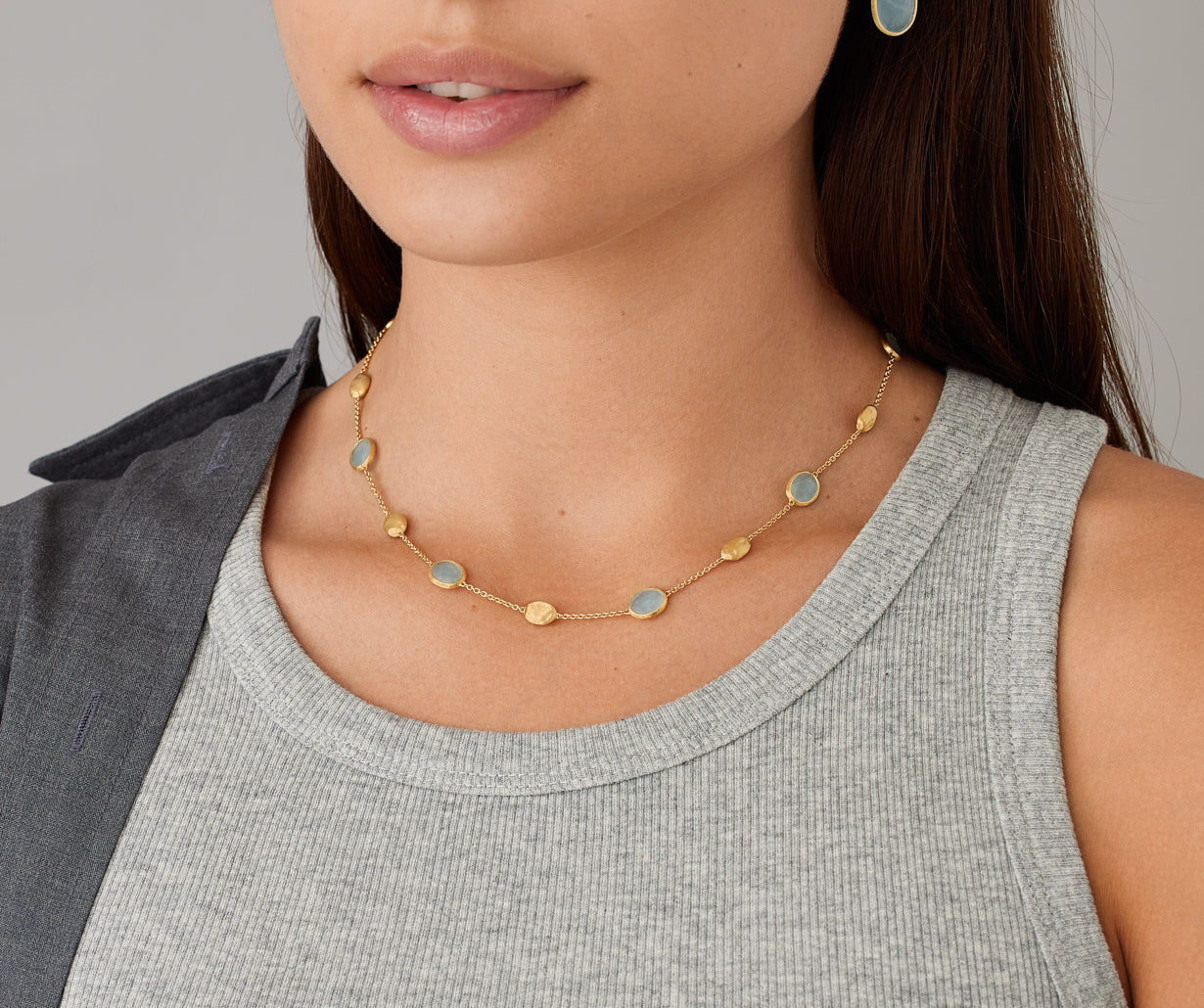 18kt yellow gold necklace with oval elements and aquamarine